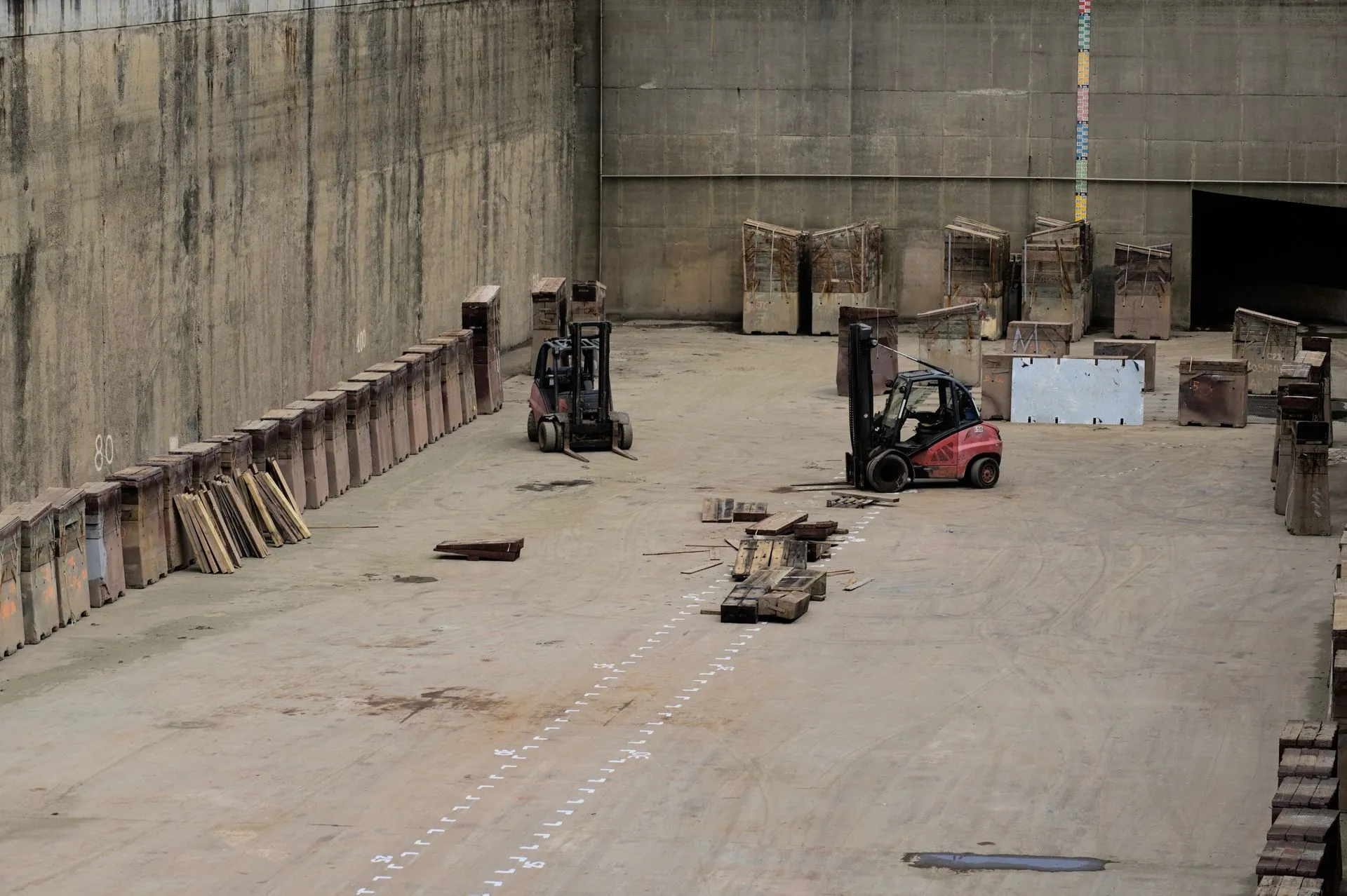 Forklifts in an industrial warehouse, representative photography