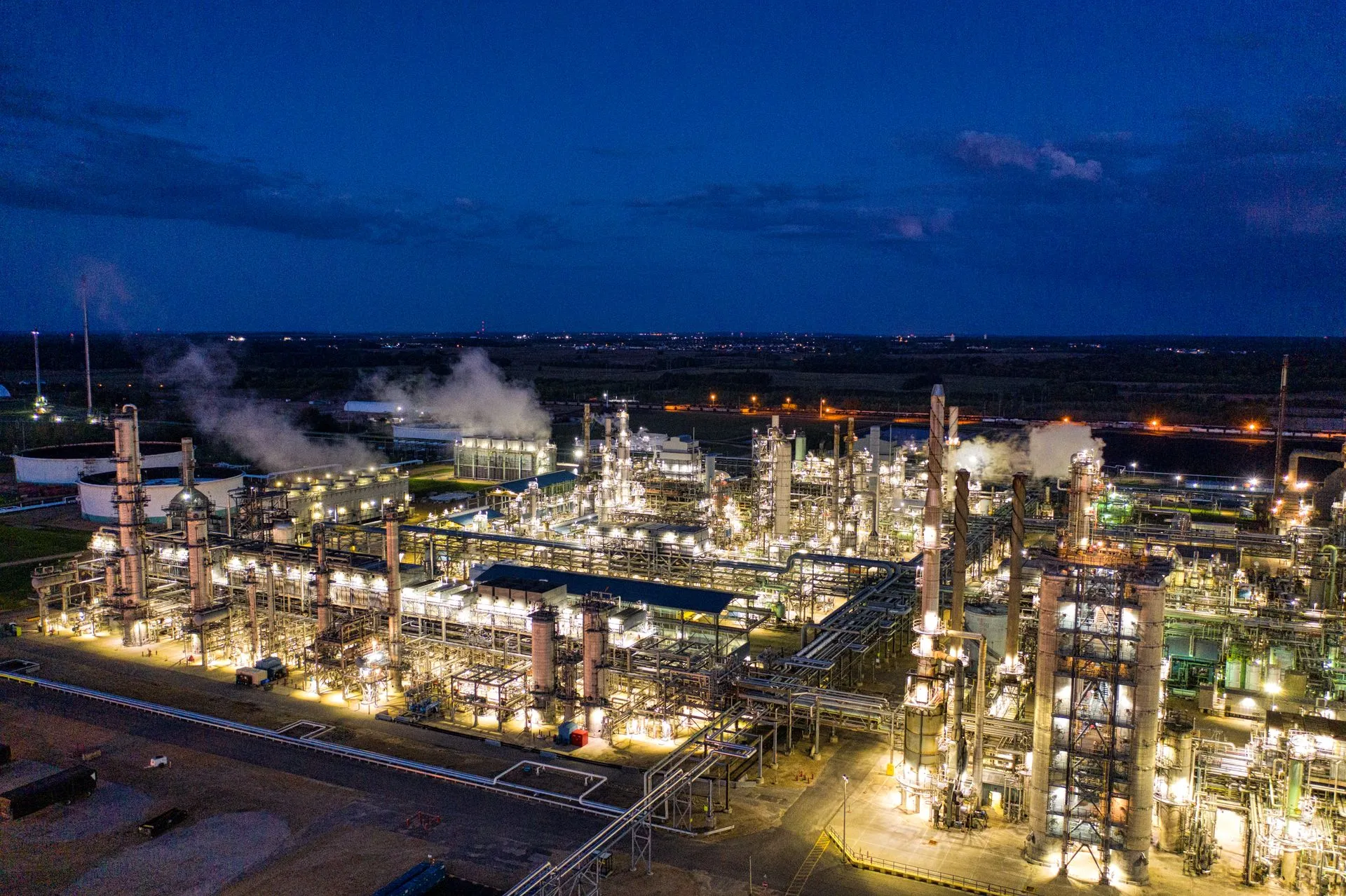 Industrial process plant at night, representative photography